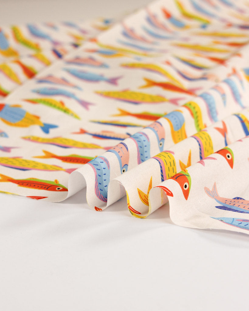 Colourful fabric with fish pattern on a white background