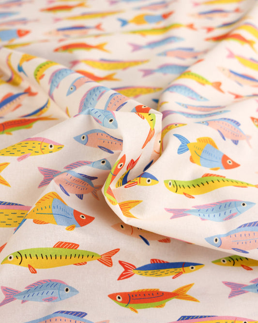 Colourful fish repeat pattern on white cotton fabric