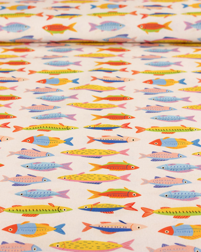 Colourful fish pattern cotton fabric on a white background