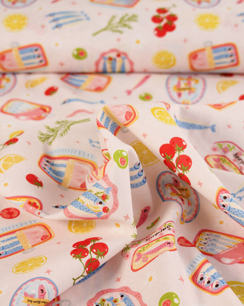 Colourful cotton fabric with cartoon seafood patterns on a white background
