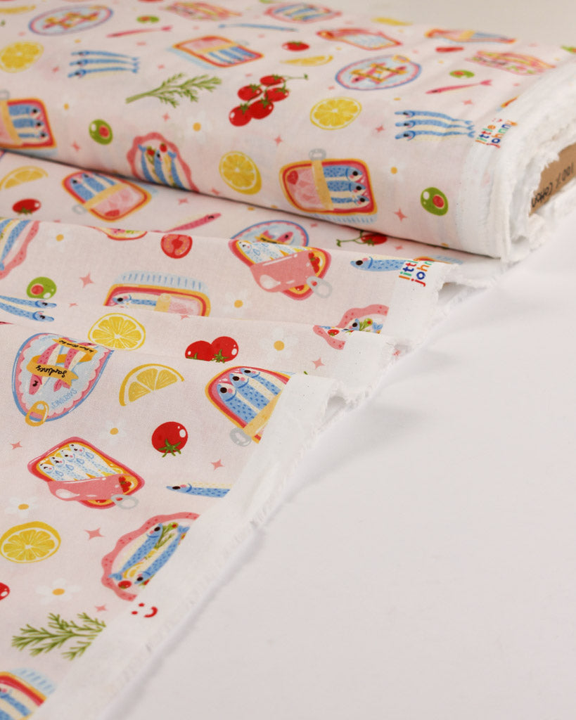Colourful cotton fabric with cartoon seafood designs on a white background