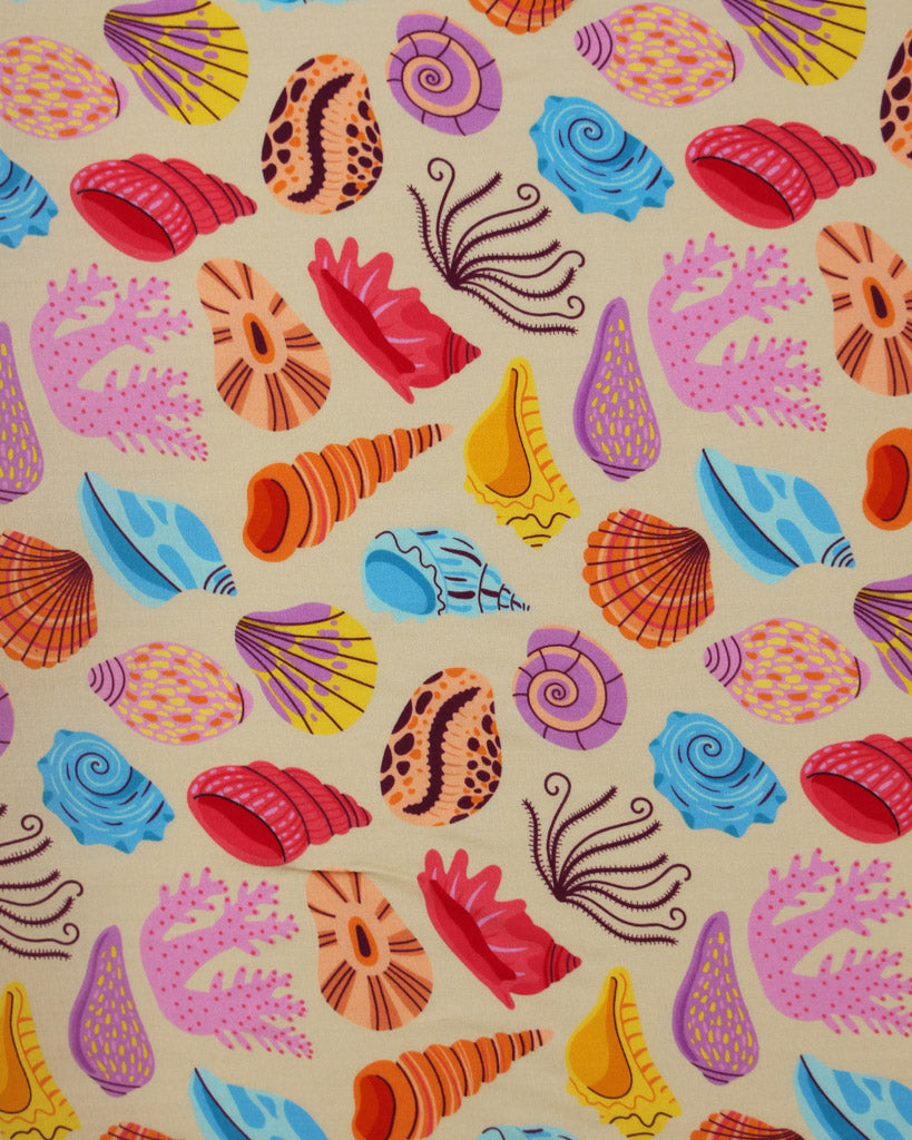 Viscose fabric with a pattern of colourful seashells and coral on a beige background