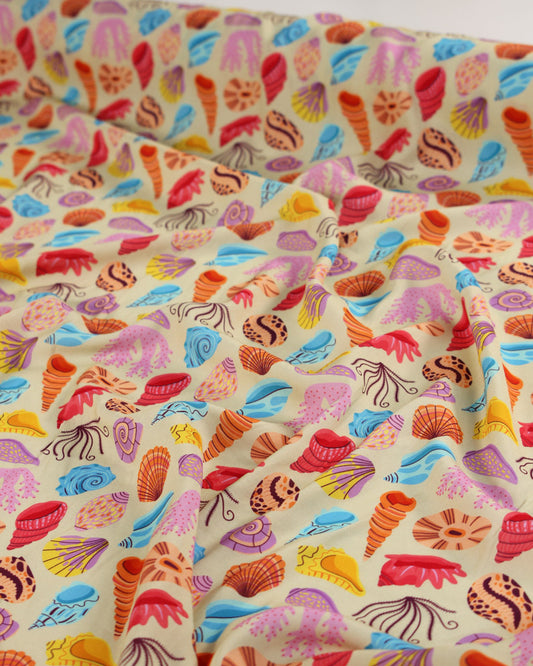 Colorful viscose fabric with shell pattern on a beige background