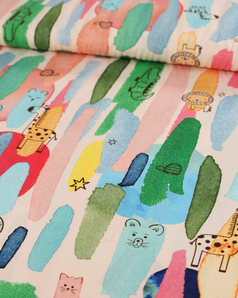 Colourful cotton lawn fabric with abstract paint brush strokes and illustrative animals