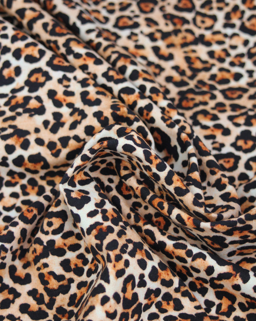 Leopard print cotton jersey fabric with a close-up view