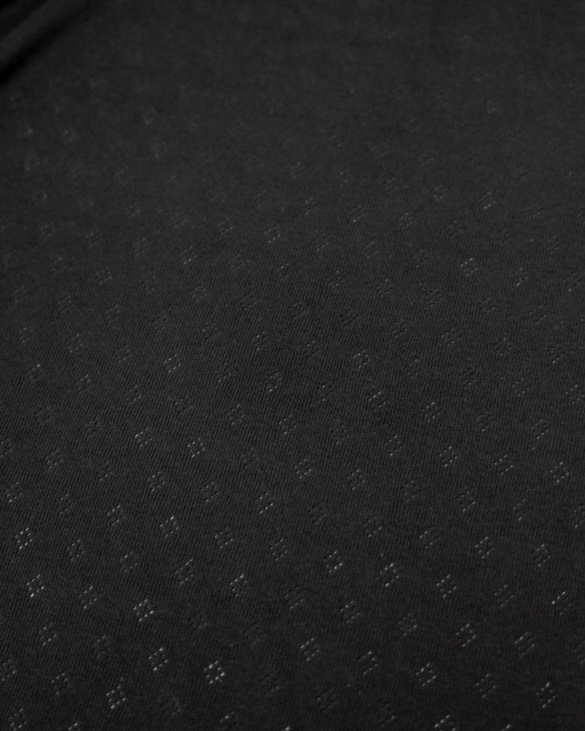 Black fabric pointelle jersey fabric with small diamond hole patterns