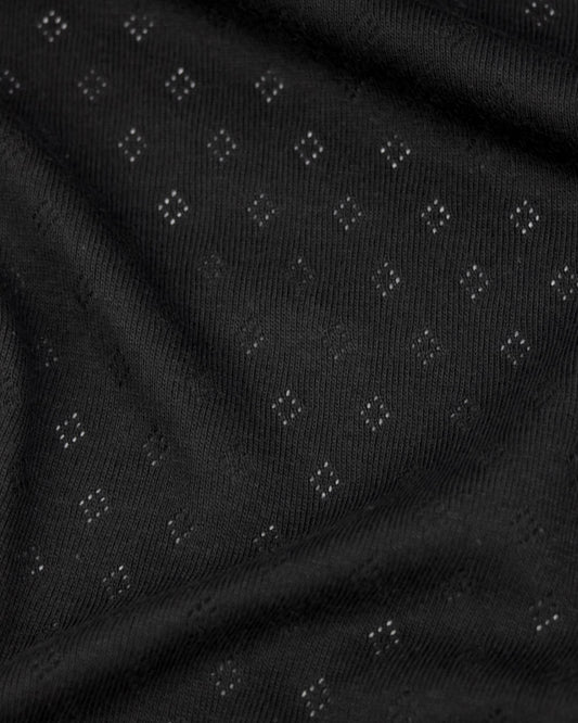 Black fabric pointelle jersey fabric with small diamond hole patterns