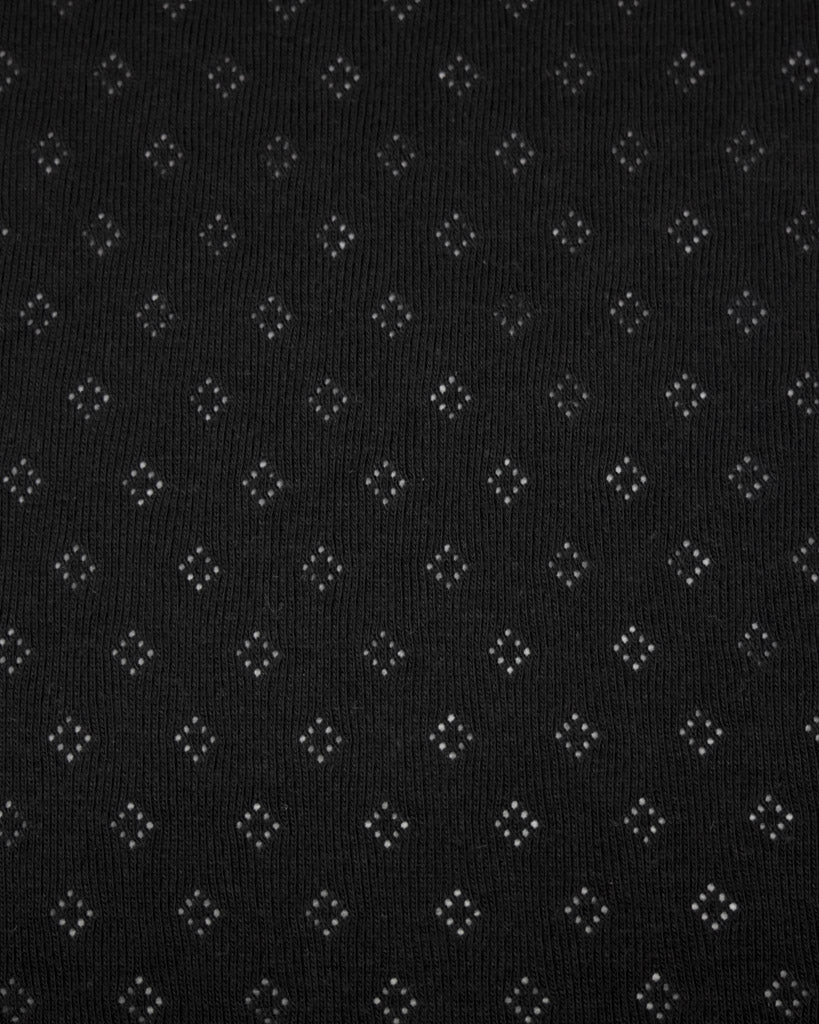 Black fabric pointelle jersey fabric with small diamond hole patterns