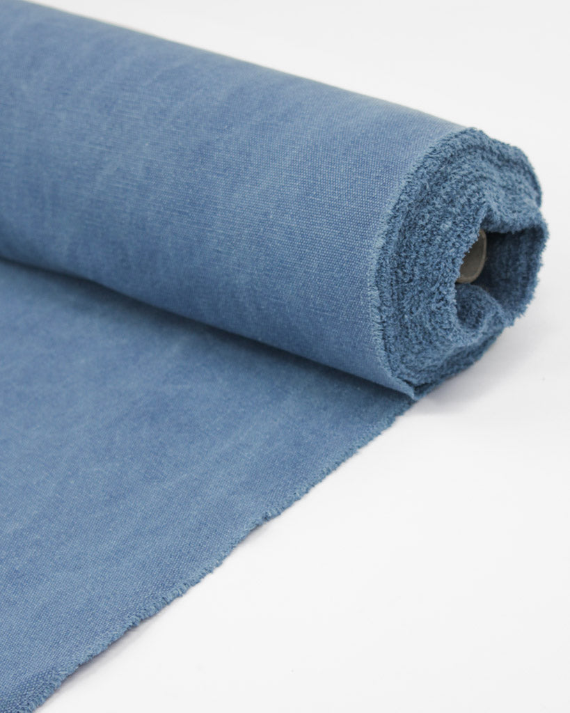 Roll of heavy cotton blend canvas fabric in blue