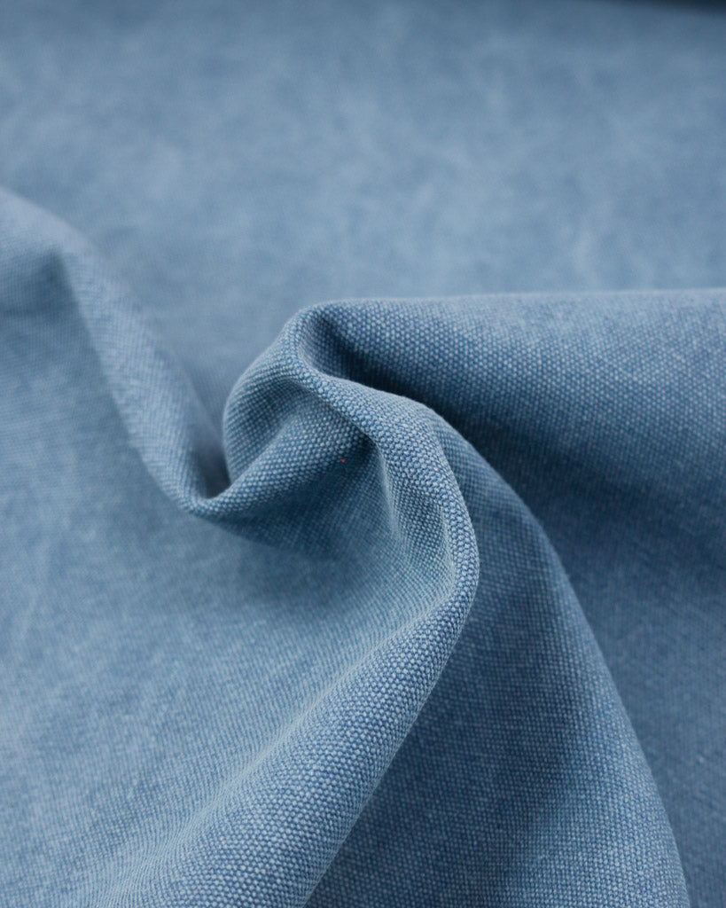Close up of heavy cotton blend canvas fabric in blue