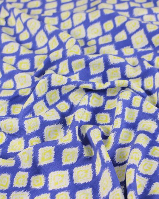 Blue viscose lawn fabric with yellow geometric pattern