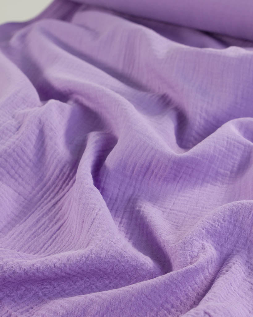 Close-up of textured lavender purple cotton double gauze fabric