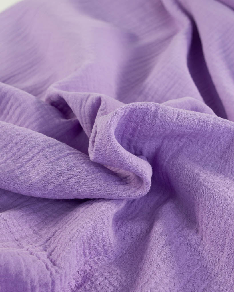 Close-up of cotton double gauze pale purple fabric
