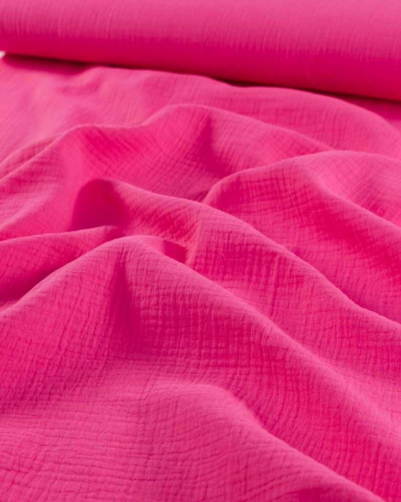 Close-up of hot pink cotton double gauze fabric