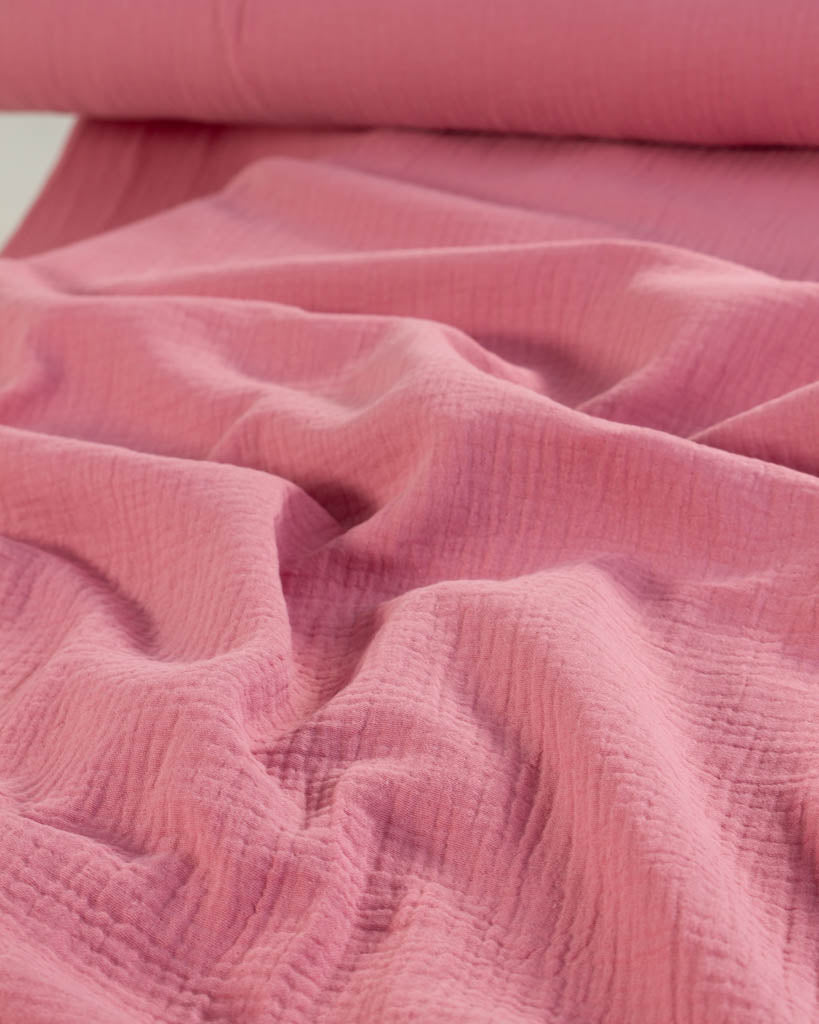 Close-up of Peony pink textured soft cotton Double Gauze fabric