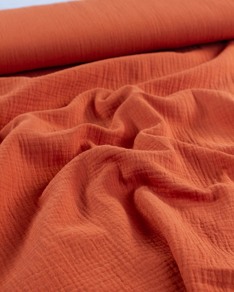 Close-up of orange cotton double gauze fabric