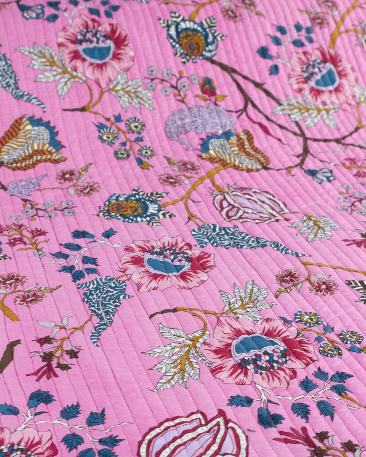 Pink cotton quilt fabric with floral and bird pattern