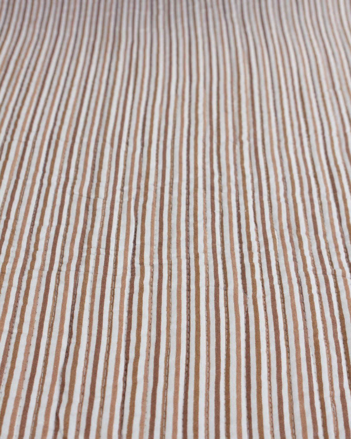 quilted cotton fabric with a brown and ivory stripe