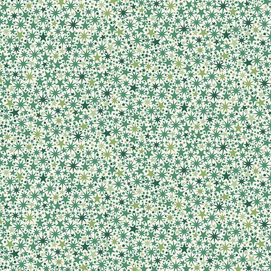 Pattern of green stars on a cream quilting cotton