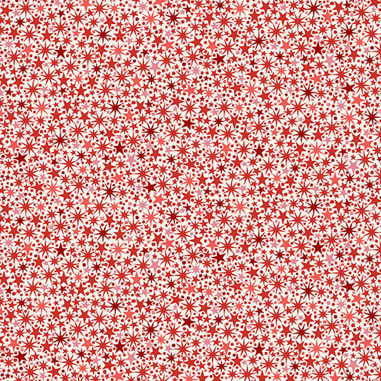 Pattern of red and white stars on a cream quilting cotton