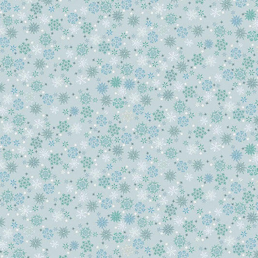 Pattern of snowflakes on a light blue quilting cotton