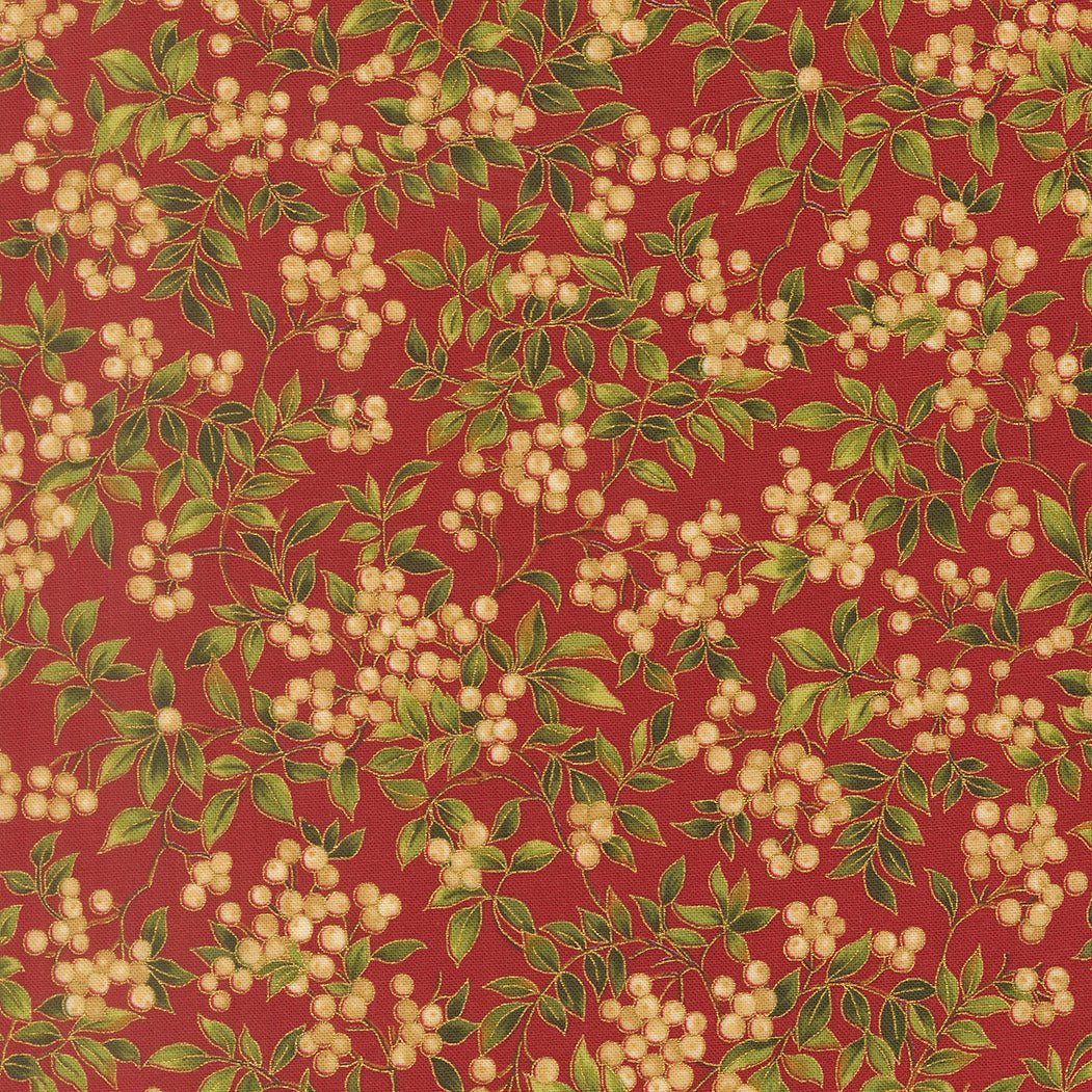 Festive fabric pattern with berries and leaves on a red quilting cotton with gold metallic details