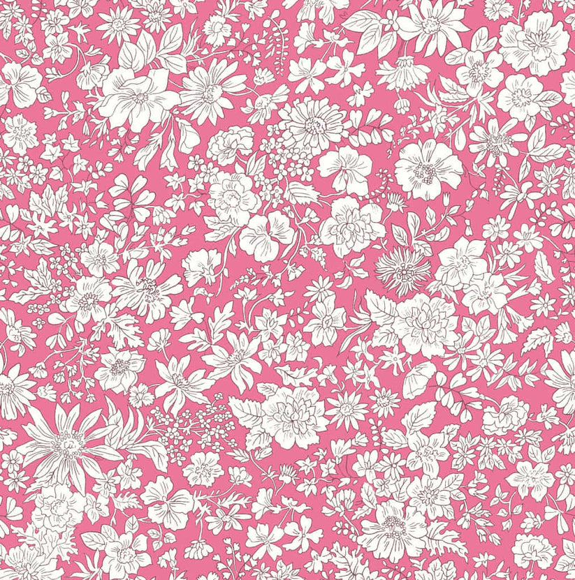 Ivory floral pattern on a pink quilting cotton