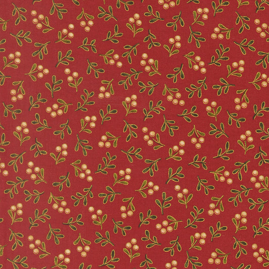 Pattern of green leaves and white berries on a red quilting cotton with metallic gold detailing