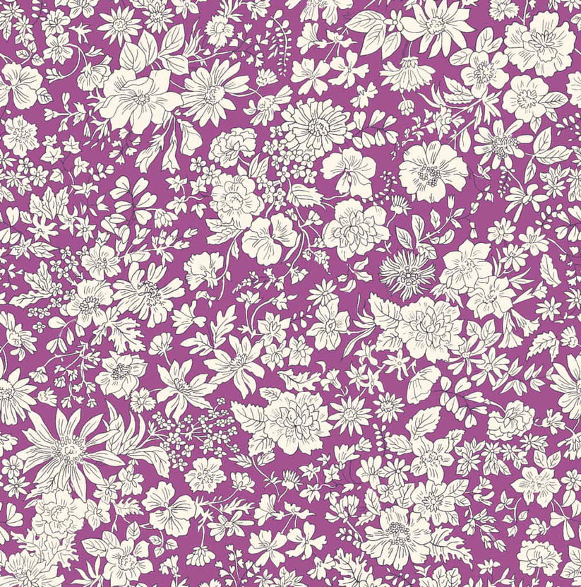 Ivory floral pattern on a purple quilting cotton