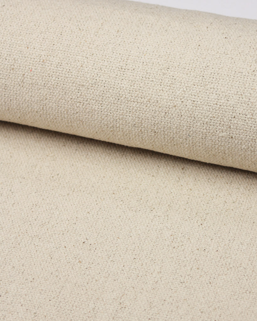 Woven cotton upholstery fabric in a natural beige