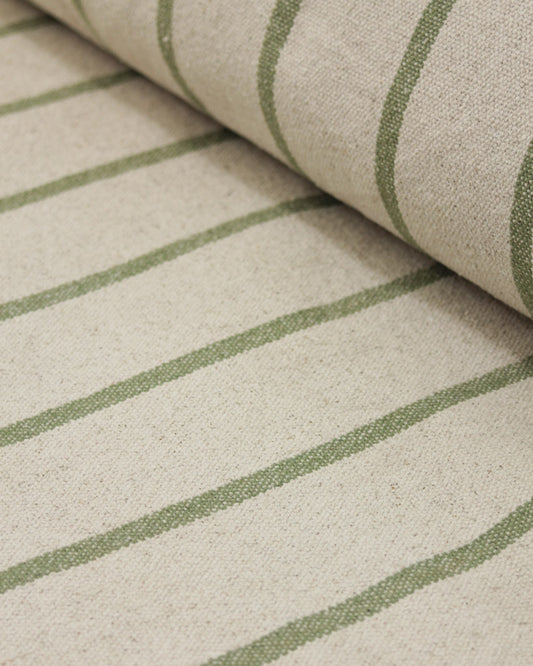 Close-up of a woven cotton fabric with a cream base and muted sage green vertical stripes