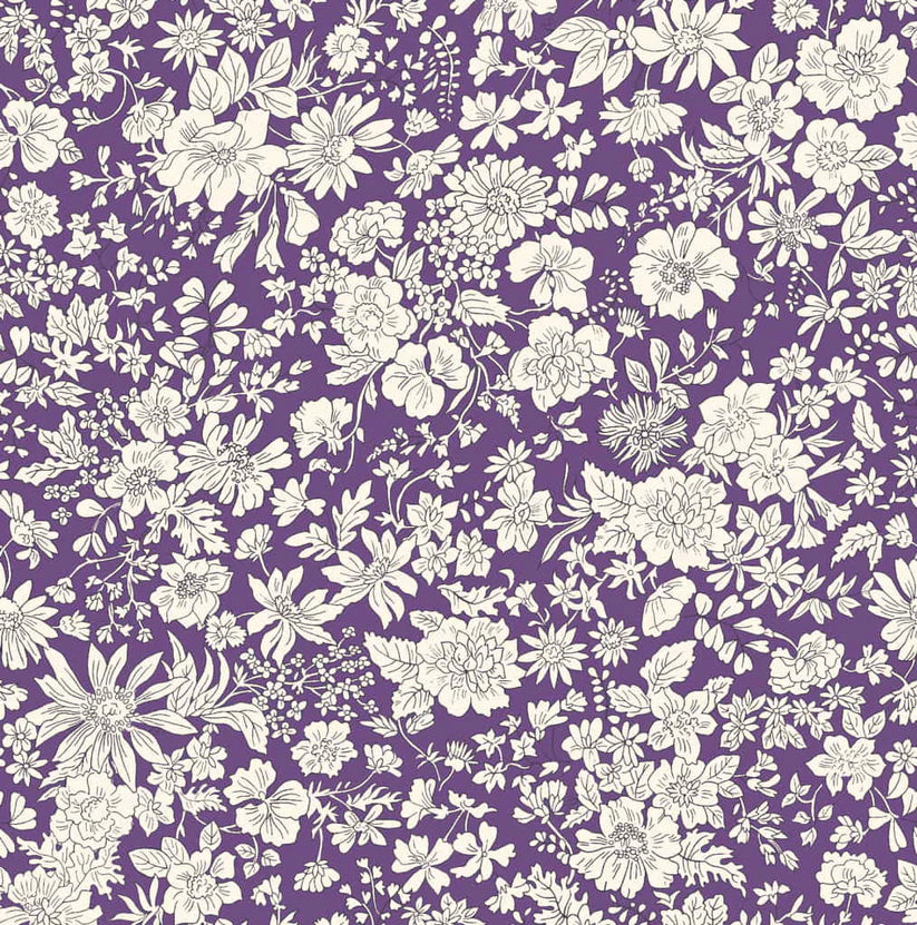 Ivory floral pattern on a purple quilting cotton