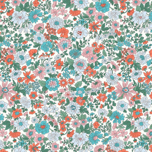 Pattern of pink, blue and red flowers with green foliage on a white quilting cotton backgroiund 
