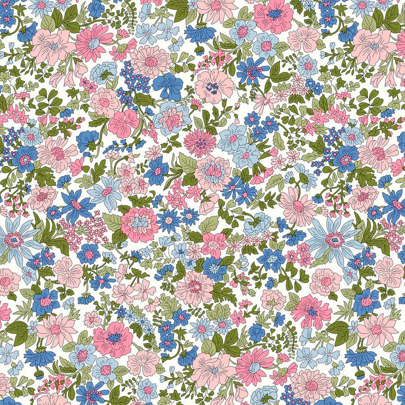 Pattern of blue and pink flowers amidst green foliage on a white quilting cotton