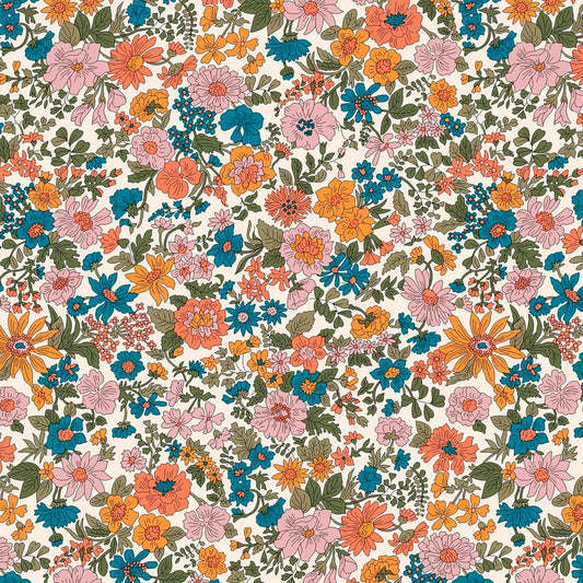 Pattern of  flowers in orange, pink and blue with green foliage on a white quilting cotton