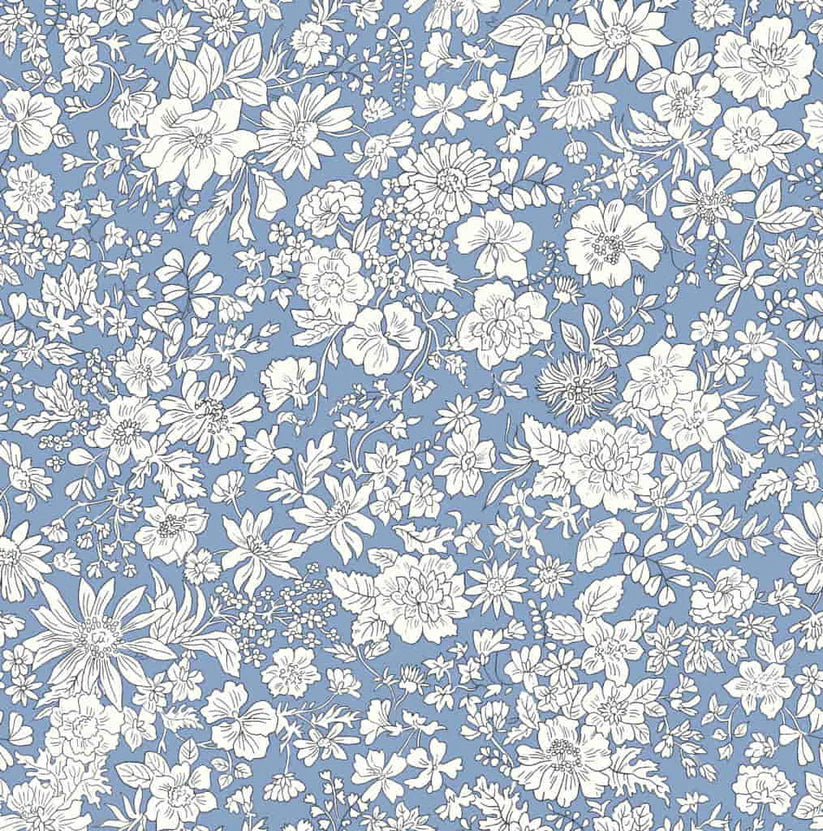 Ivory floral pattern on a blue quilting cotton
