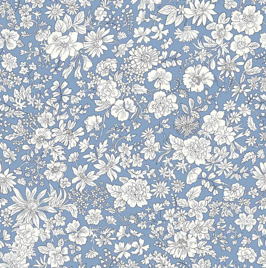 Ivory floral pattern on a blue quilting cotton