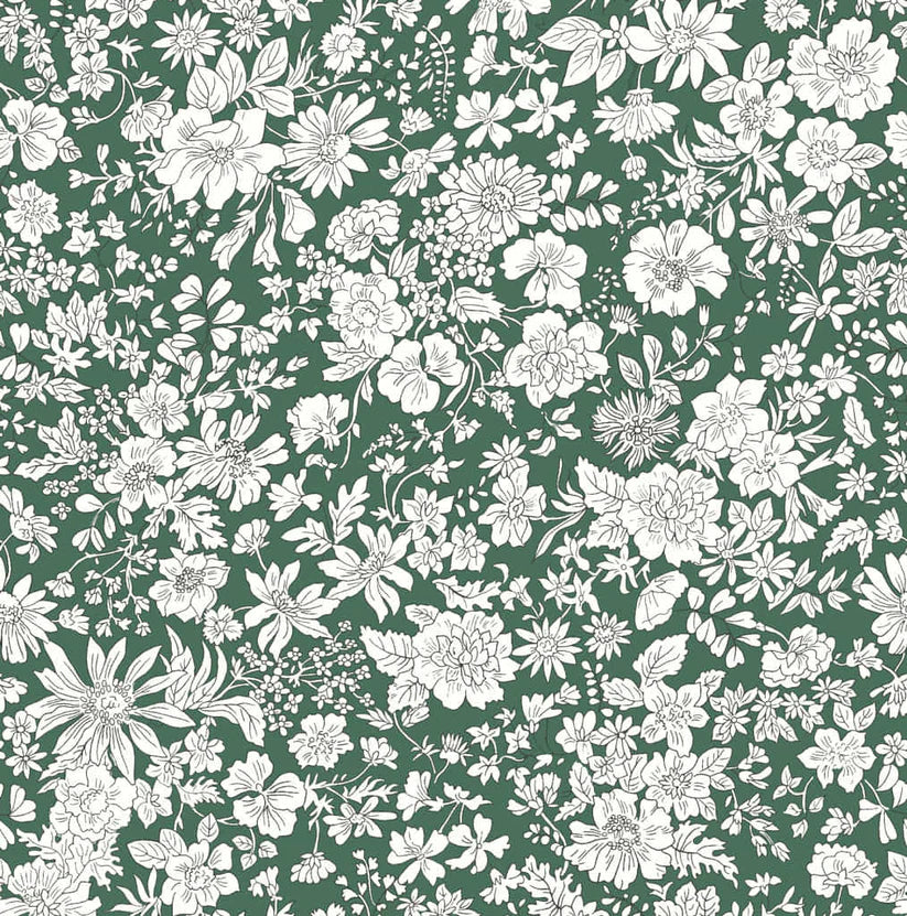 Ivory floral pattern on a deep green quilting cotton