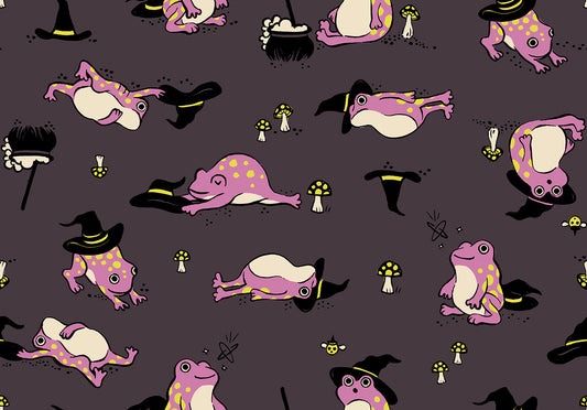 Pattern of cartoon frogs in witch costumes on a dark eggplant quilting cotton