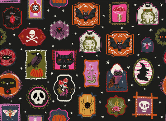 Halloween-themed gallery frames with various spooky designs on a black quilting cotton.