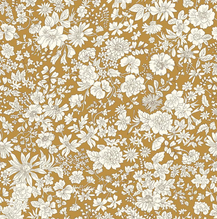 Ivory floral pattern on a mustard yellow quilting cotton