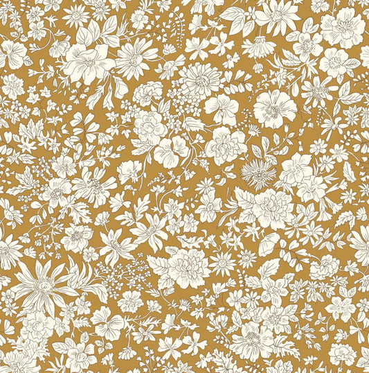 Ivory floral pattern on a mustard yellow quilting cotton