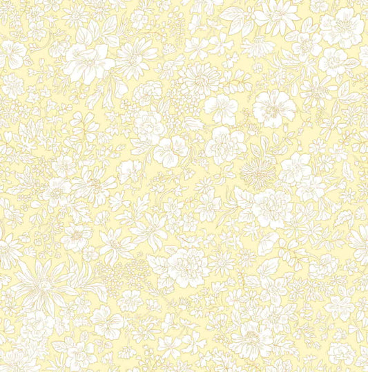 Ivory floral pattern on a pale yellow quilting cotton