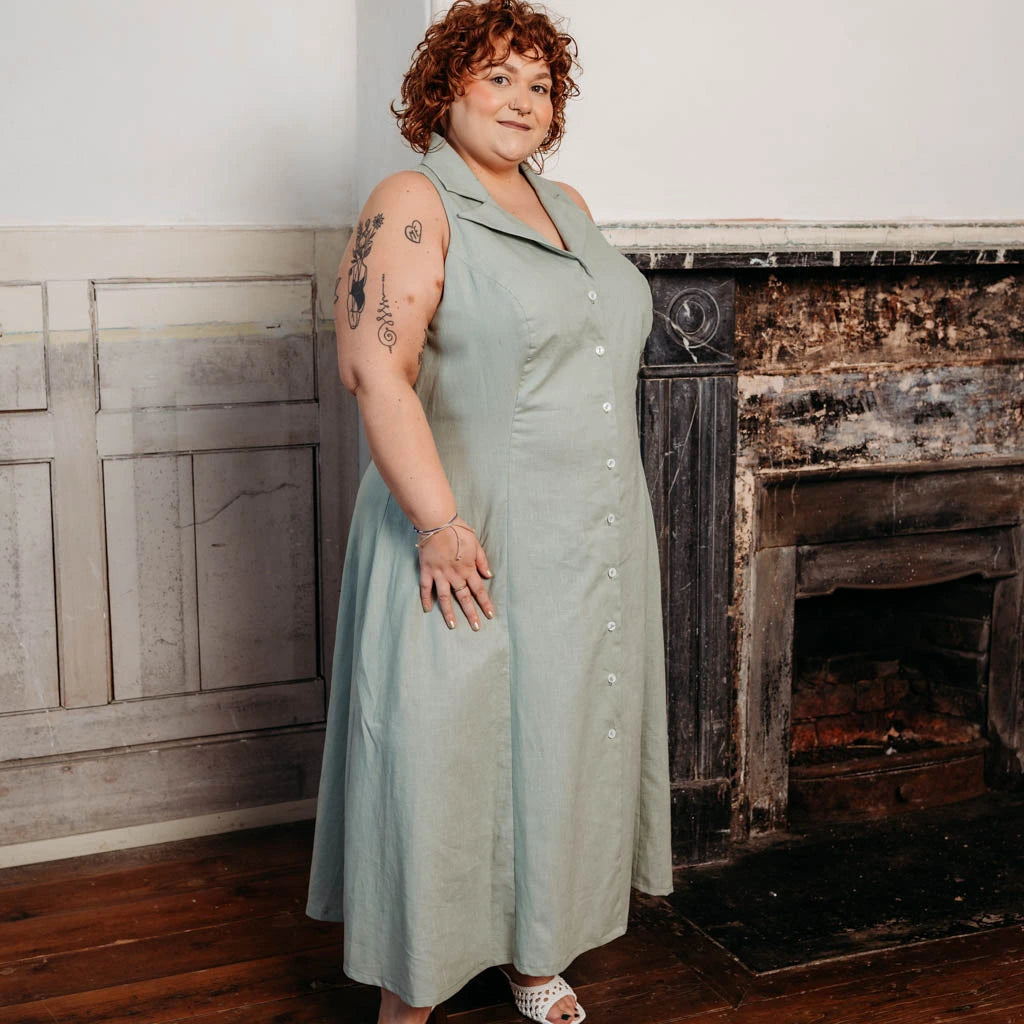 Woman wearing a long brown dress made using the Diana dress sewing pattern from NH Patterns
