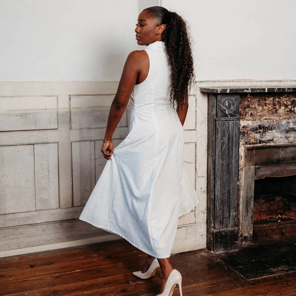 Woman wearing a long brown dress made using the Diana dress sewing pattern from NH Patterns