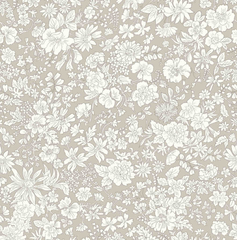 Ivory floral pattern on a beige quilting cotton