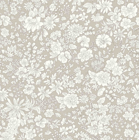 Ivory floral pattern on a beige quilting cotton