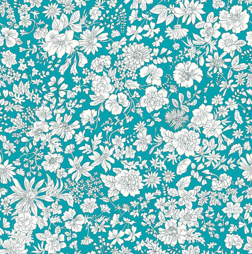 Ivory floral pattern on a turquoise quilting cotton