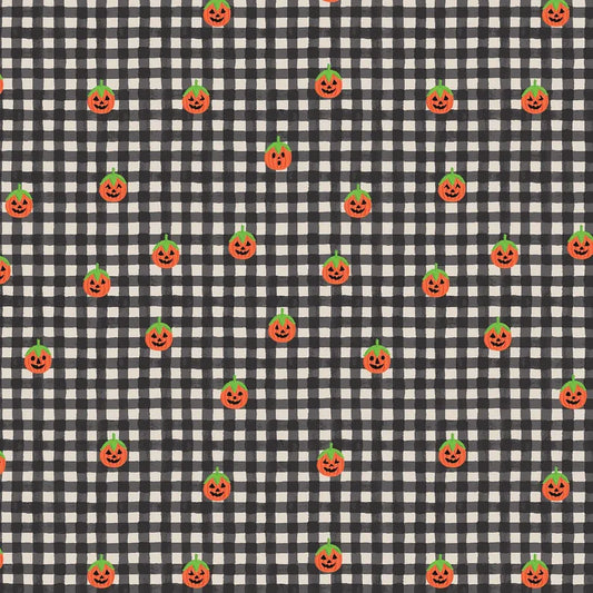 A repeating Halloween pattern featuring small orange jack-o'-lantern pumpkins with green tops on a black and white gingham check quilting cotton