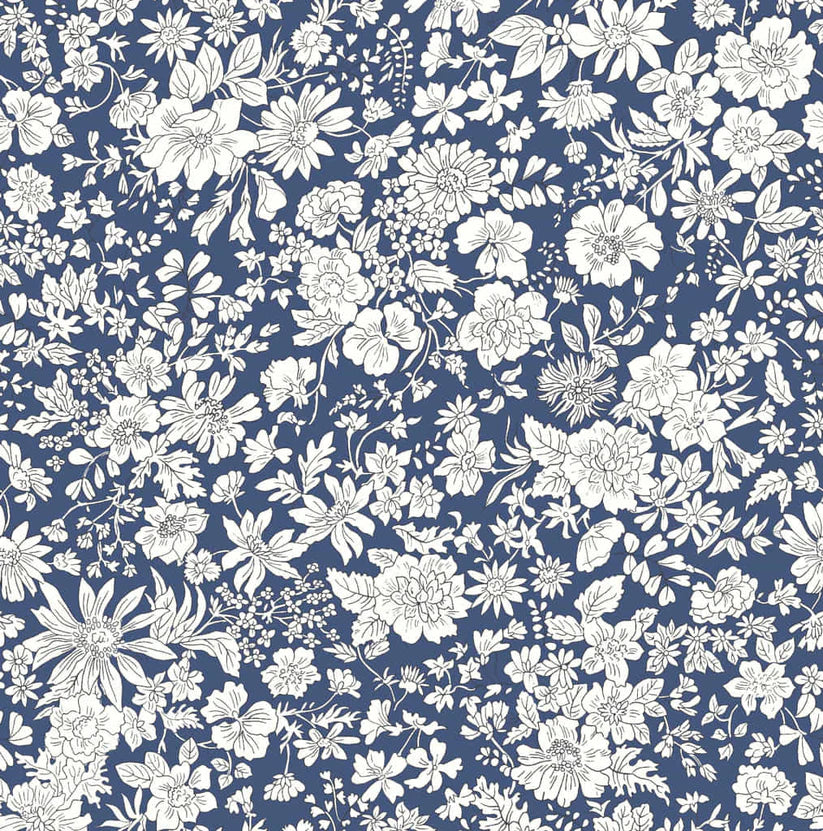 Ivory floral pattern on a navy blue quilting cotton